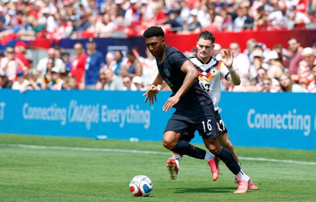 Alex Freeman of the US controls the ball in front of Germany's Florian Wirtz during the international friendly football match between USA and Germany at Soldier Field in Chicago, Illinois, on June 6, 2026. (Photo by KAMIL KRZACZYNSKI / AFP)