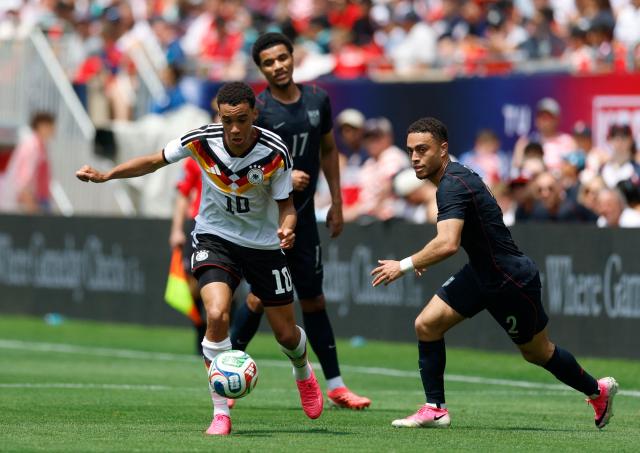 Germany's Jamal Musiala runs with the ball during the international friendly football match between USA and Germany at Soldier Field in Chicago, Illinois, on June 6, 2026. (Photo by KAMIL KRZACZYNSKI / AFP)