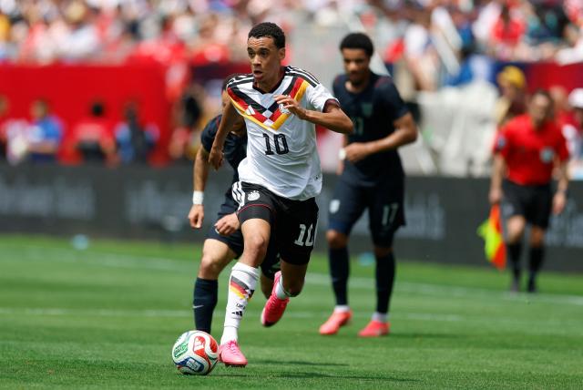 Germany's Jamal Musiala runs with the ball during the international friendly football match between USA and Germany at Soldier Field in Chicago, Illinois, on June 6, 2026. (Photo by KAMIL KRZACZYNSKI / AFP)