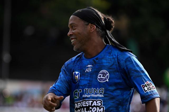 Brazilian former football star Ronaldinho gestures during the Monumental League exhibition football match between CLX Futbol and Patacones FC at the Mesuca community in the Petare neighborhood in Caracas on June 6, 2026. (Photo by Federico PARRA / AFP)