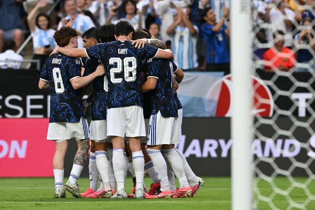 Argentina's players celerate after forward #22 Lautaro Martinez scored a goal during the international friendly football match between Argentina and Honduras at Kyle Field in College Station, Texas on June 6, 2026. (Photo by RONALDO SCHEMIDT / AFP)