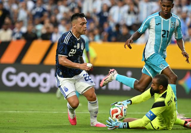 Honduras' goalkeeper #01 Edrick Menjivar blocks an attempted shot on goal by Argentina's forward #22 Lautaro Martinez during the international friendly football match between Argentina and Honduras at Kyle Field in College Station, Texas on June 6, 2026. (Photo by RONALDO SCHEMIDT / AFP)