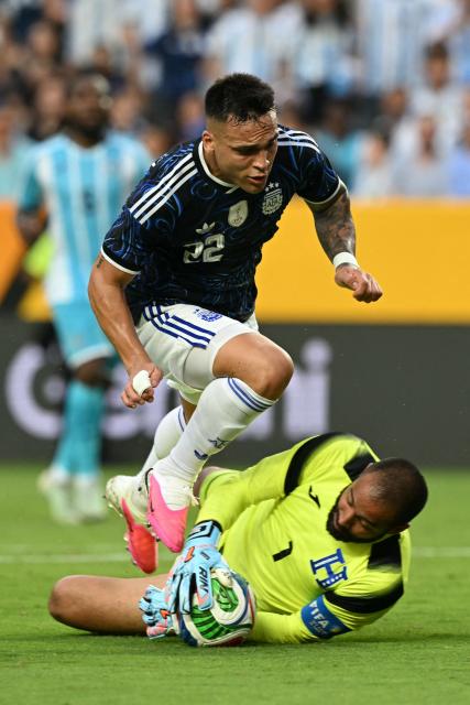 Honduras' goalkeeper #01 Edrick Menjivar blocks an attempted shot on goal by Argentina's forward #22 Lautaro Martinez during the international friendly football match between Argentina and Honduras at Kyle Field in College Station, Texas on June 6, 2026. (Photo by RONALDO SCHEMIDT / AFP)