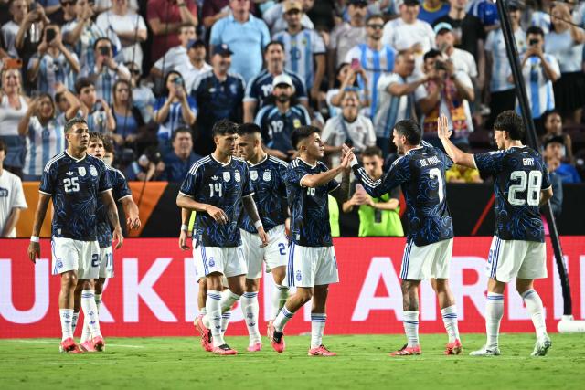 Argentina's players celebrate after scoring their second goal during the international friendly football match between Argentina and Honduras at Kyle Field in College Station, Texas on June 6, 2026. (Photo by RONALDO SCHEMIDT / AFP)