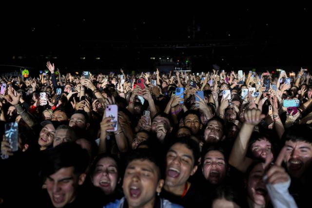 Fans of Argentine singer Lali Esposito attend her concert as part of her Lali Tour 2025/26 at the Mas Monumental Stadium in Buenos Aires on June 6, 2026. (Photo by Luis ROBAYO / AFP)