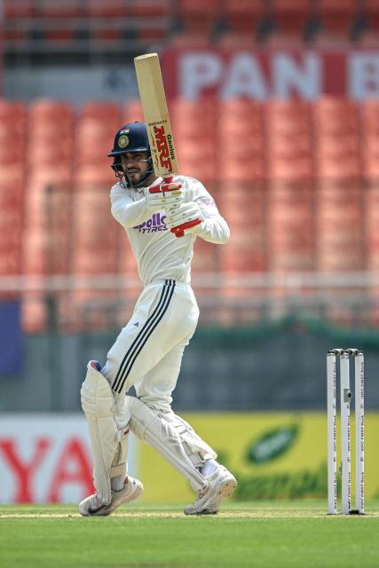 India's captain Shubman Gill watches the ball after playing a shot during the second day of the only Test cricket match between India and Afghanistan at the Maharaja Yadavindra Singh International Cricket Stadium on the outskirts of Chandigarh on June 7, 2026. (Photo by Shammi MEHRA / AFP)