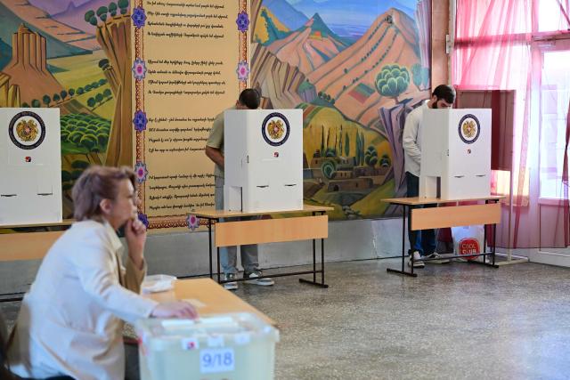 Armenians vote in the parliamentary election at a polling station in Yerevan on June 7, 2026. (Photo by Karen MINASYAN / AFP)