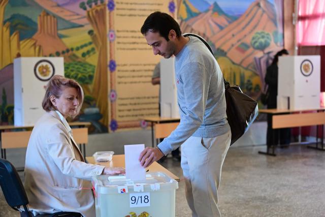 Armenians vote in the parliamentary election at a polling station in Yerevan on June 7, 2026. (Photo by Karen MINASYAN / AFP)