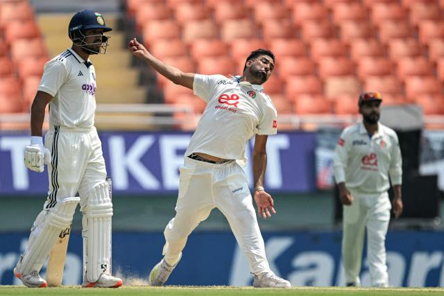Afghanistan's Mohammad Saleem (C) bowls during the second day of the only Test cricket match between India and Afghanistan at the Maharaja Yadavindra Singh International Cricket Stadium on the outskirts of Chandigarh on June 7, 2026. (Photo by Shammi MEHRA / AFP)