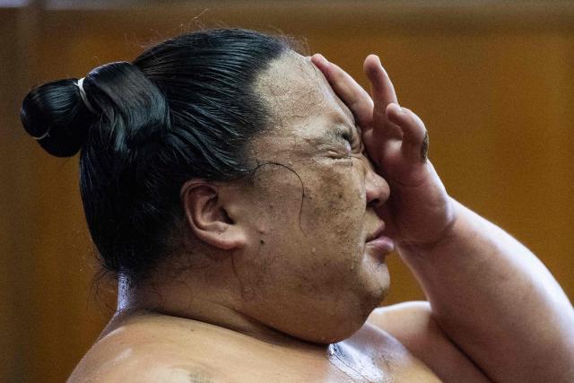 Sumo wrestler Dewanoryu trains in the dohyo, a wrestling ring, at the Dewanoumi sumo stable in Tokyo on June 4, 2026. The stable, founded in 1862 and one of the sport's oldest, has become a major lineage in modern sumo, producing many top-division wrestlers. (Photo by Andrew CABALLERO-REYNOLDS / AFP)