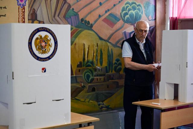 A man votes in Armenia's parliamentary election at a polling station in Yerevan on June 7, 2026. (Photo by Karen MINASYAN / AFP)