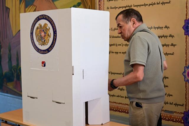 A man votes in Armenia's parliamentary election at a polling station in Yerevan on June 7, 2026. (Photo by Karen MINASYAN / AFP)