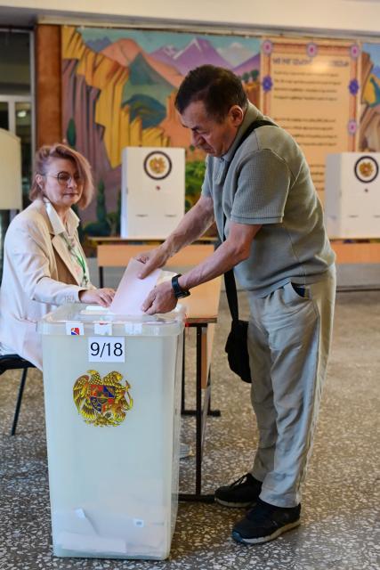 A man votes in Armenia's parliamentary election at a polling station in Yerevan on June 7, 2026. (Photo by Karen MINASYAN / AFP)