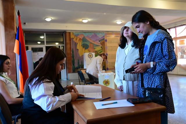 Armenians vote in the parliamentary election at a polling station in Yerevan on June 7, 2026. (Photo by Karen MINASYAN / AFP)
