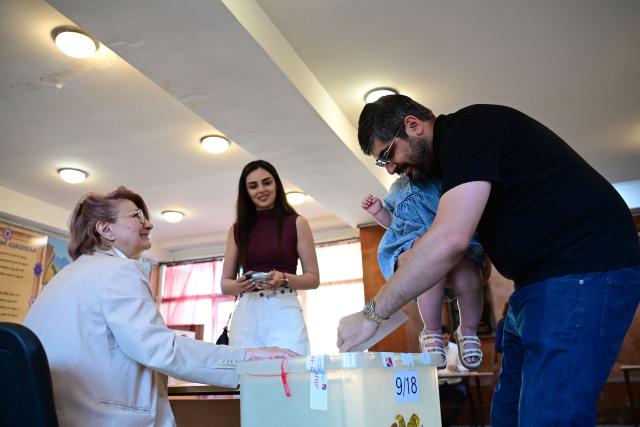 Armenians vote in the parliamentary election at a polling station in Yerevan on June 7, 2026. (Photo by Karen MINASYAN / AFP)