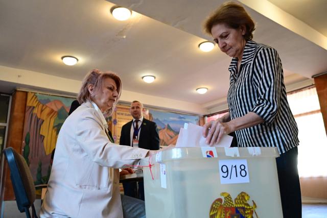 A woman casts her ballot in Armenia's parliamentary election at a polling station in Yerevan on June 7, 2026. (Photo by Karen MINASYAN / AFP)