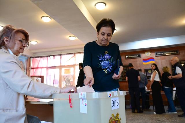 Armenians vote in the parliamentary election at a polling station in Yerevan on June 7, 2026. (Photo by Karen MINASYAN / AFP)