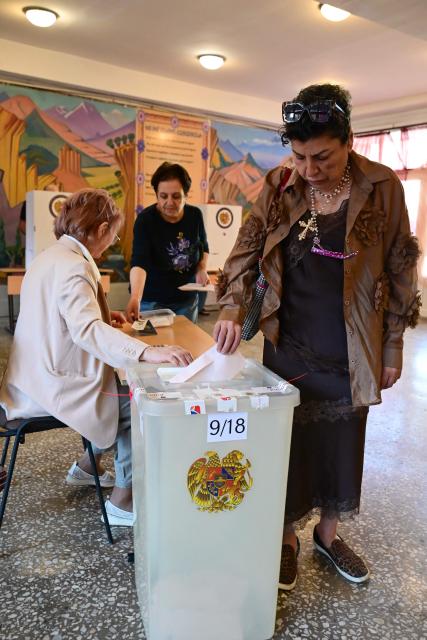 Armenians vote in the parliamentary election at a polling station in Yerevan on June 7, 2026. (Photo by Karen MINASYAN / AFP)