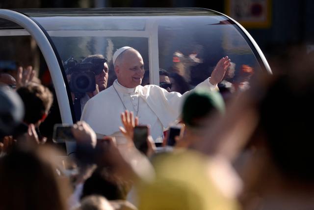 Pope Leo XIV waves from the popemobile as he arrives to lead the Holy Mass in the Plaza de Cibeles in Madrid on June 7, 2026. Pope Leo XIV is visiting Spain June 6-12 with stops in Madrid, Barcelona, and the Canary Islands, where he will meet with migrants and organisations dedicated to helping them. (Photo by Oscar DEL POZO / AFP)