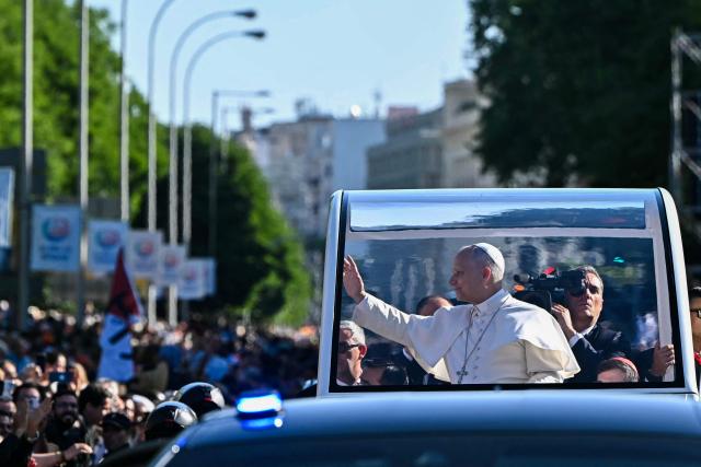 Pope Leo XIV waves to faithful as he arrives in the popemobile to lead the Holy Mass in the Plaza de Cibeles in Madrid on June 7, 2026. Pope Leo XIV is visiting Spain June 6-12 with stops in Madrid, Barcelona, and the Canary Islands, where he will meet with migrants and organisations dedicated to helping them. (Photo by Javier SORIANO / AFP)
