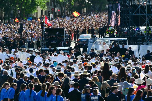 Pope Leo XIV waves to faithful as he arrives in the popemobile to lead the Holy Mass in the Plaza de Cibeles in Madrid on June 7, 2026. Pope Leo XIV is visiting Spain June 6-12 with stops in Madrid, Barcelona, and the Canary Islands, where he will meet with migrants and organisations dedicated to helping them. (Photo by Stefano RELLANDINI / AFP)