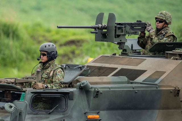 Japan Ground Self-Defense Force (JGSDF) soldiers take part in a live fire exercise at East Fuji Maneuver Area in Gotemba on June 7, 2026. (Photo by Yuichi YAMAZAKI / AFP)