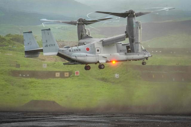 A V-22 Osprey tilt-rotor aircraft of the Japan Ground Self-Defense Force (JGSDF) hovers during a live fire exercise at East Fuji Maneuver Area in Gotemba on June 7, 2026. (Photo by Yuichi YAMAZAKI / AFP)