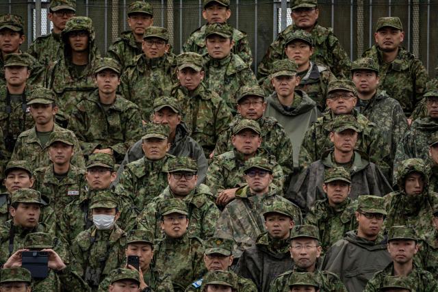 Members of the Japan Ground Self-Defense Force (JGSDF) watch a live fire exercise at East Fuji Maneuver Area in Gotemba on June 7, 2026. (Photo by Yuichi YAMAZAKI / AFP)