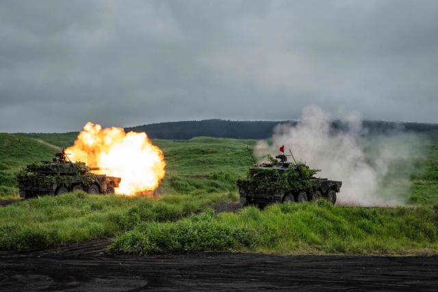 Type 16 combat vehicles of the Japan Ground Self-Defense Force (JGSDF) fire ammunition during a live fire exercise at East Fuji Maneuver Area in Gotemba on June 7, 2026. (Photo by Yuichi YAMAZAKI / AFP)