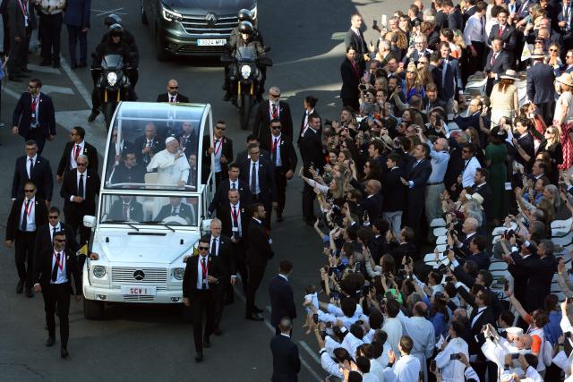 Pope Leo XIV waves from the popemobile as he arrives to lead the Holy Mass in the Plaza de Cibeles in Madrid on June 7, 2026. Pope Leo XIV is visiting Spain June 6-12 with stops in Madrid, Barcelona, and the Canary Islands, where he will meet with migrants and organisations dedicated to helping them. (Photo by Pierre-Philippe MARCOU / AFP)