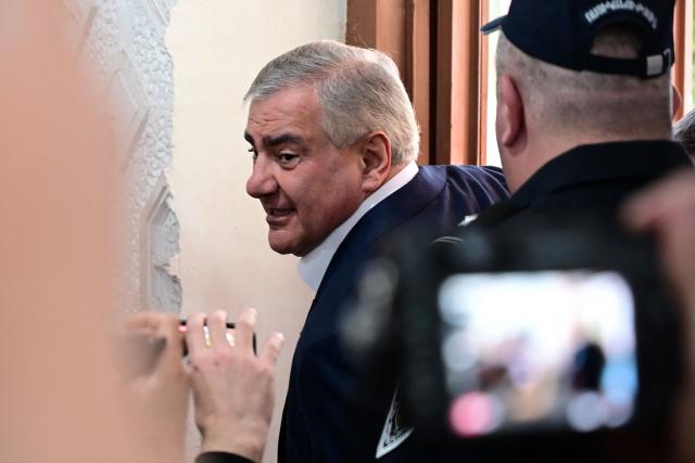 Billionaire Russian-Armenian businessman Samvel Karapetyan, the leader of Strong Armenia party who is under house arrest on charges of plotting a coup, arrives at a polling station to vote in Armenia's parliamentary election in Yerevan on June 7, 2026. (Photo by Karen MINASYAN / AFP)