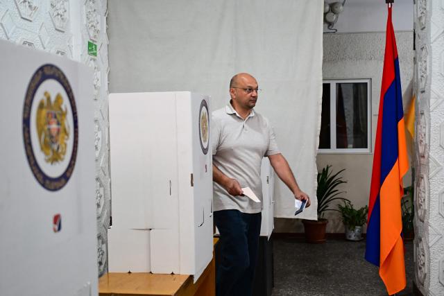 A man votes in Armenia's parliamentary election at a polling station in Yerevan on June 7, 2026. (Photo by Karen MINASYAN / AFP)