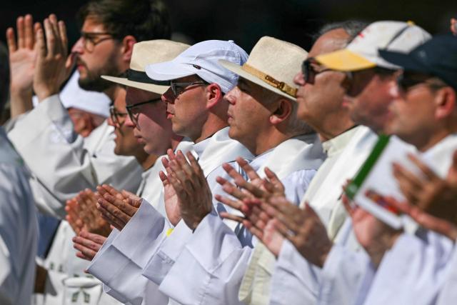 Priests attend the Holy Mass lead by Pope Leo XIV in the Plaza de Cibeles in Madrid on June 7, 2026. Pope Leo XIV is visiting Spain June 6-12 with stops in Madrid, Barcelona, and the Canary Islands, where he will meet with migrants and organisations dedicated to helping them. (Photo by Javier SORIANO / AFP)