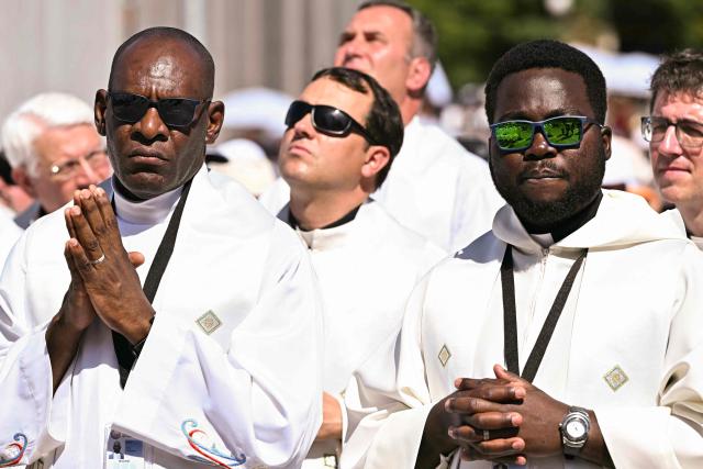Priests attend the Holy Mass lead by Pope Leo XIV in the Plaza de Cibeles in Madrid on June 7, 2026. Pope Leo XIV is visiting Spain June 6-12 with stops in Madrid, Barcelona, and the Canary Islands, where he will meet with migrants and organisations dedicated to helping them. (Photo by Javier SORIANO / AFP)