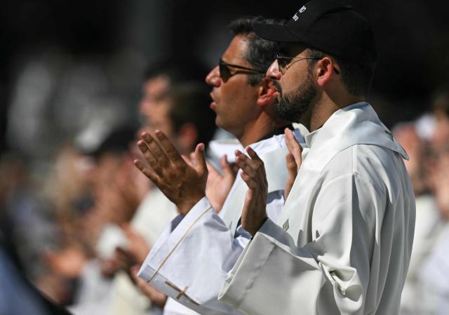 Priests attend the Holy Mass lead by Pope Leo XIV in the Plaza de Cibeles in Madrid on June 7, 2026. Pope Leo XIV is visiting Spain June 6-12 with stops in Madrid, Barcelona, and the Canary Islands, where he will meet with migrants and organisations dedicated to helping them. (Photo by Javier SORIANO / AFP)