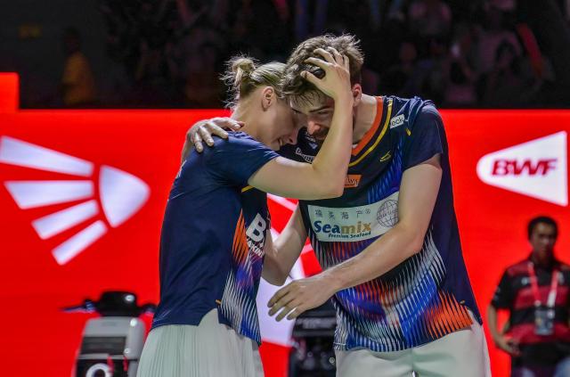 (L-R) Denmark's Alexandra Boje and Mathias Christiansen react after winning their mixed doubles final match against China's Cheng Xing and Zhang Chi at the Indonesia Open badminton tournament in Jakarta on June 7, 2026. (Photo by BAY ISMOYO / AFP)