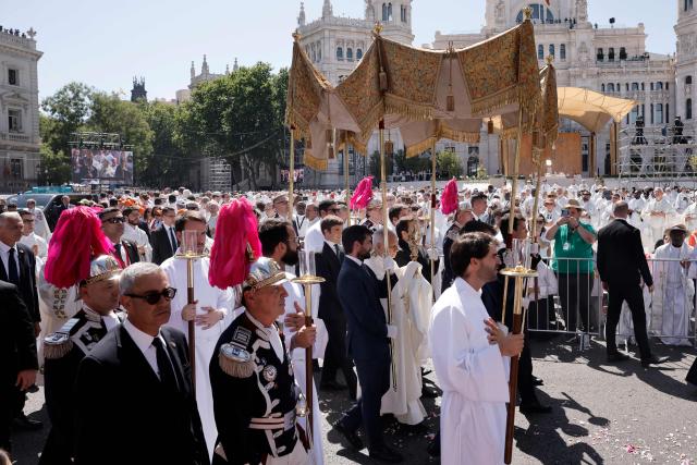 Pope Leo XIV walks under a processional canopy during the Corpus Christi procession following the Holy Mass held in the Plaza de Cibeles in Madrid on June 7, 2026. Pope Leo XIV is visiting Spain June 6-12 with stops in Madrid, Barcelona, and the Canary Islands, where he will meet with migrants and organisations dedicated to helping them. (Photo by Oscar DEL POZO / AFP)
