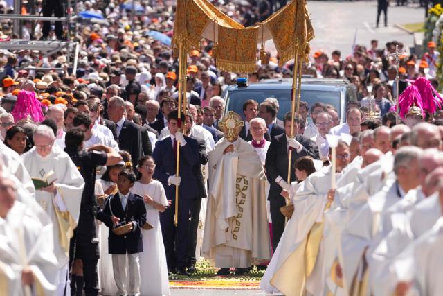 Pope Leo XIV walks along Alcala Street during the Corpus Christi procession following the Holy Mass held in the Plaza de Cibeles in Madrid on June 7, 2026. Pope Leo XIV is visiting Spain June 6-12 with stops in Madrid, Barcelona, and the Canary Islands, where he will meet with migrants and organisations dedicated to helping them. (Photo by Cesar MANSO / AFP)