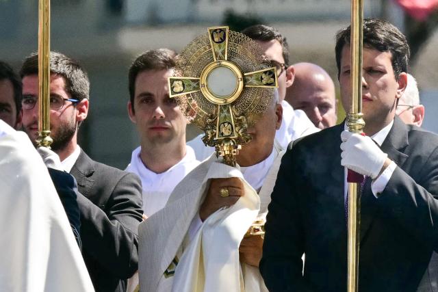 Pope Leo XIV walks along Alcala Street during the Corpus Christi procession following the Holy Mass held in the Plaza de Cibeles in Madrid on June 7, 2026. Pope Leo XIV is visiting Spain June 6-12 with stops in Madrid, Barcelona, and the Canary Islands, where he will meet with migrants and organisations dedicated to helping them. (Photo by Stefano RELLANDINI / AFP)