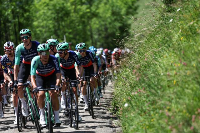 Lidl-Trek's US rider Quinn Simmons (L) and Decathlon CMA CGM Team's French rider Paul Seixas (R) cycle with the pack of riders (peloton) during the 1st stage of the Tour Auvergne-Rhone-Alpes cycling race (formerly known as the Criterium du Dauphine), 146,2km between Vizille and Saint-Ismier, in the French Alps, on June 7, 2026. (Photo by Anne-Christine POUJOULAT / AFP)