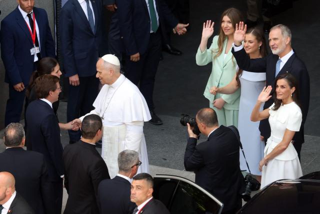 (From R) Queen Letizia, King Felipe VI, Crown Princess Leonor and Princess Sofia wave as Pope Leo XIV shakes hands with Mayor of Madrid Jose Luis Rodriguez Almeida and his wife after the Holy Mass led by the pope in the Plaza de Cibeles in Madrid on June 7, 2026. Pope Leo XIV is visiting Spain June 6-12 with stops in Madrid, Barcelona, and the Canary Islands, where he will meet with migrants and organisations dedicated to helping them. (Photo by Pierre-Philippe MARCOU / AFP)