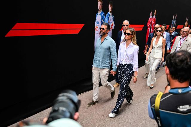 Donald Trump Jr. (L) and his partner Bettina Anderson (R) arrive in the paddock ahead of the Monaco Formula 1 Grand Prix at the Monaco street circuit in Monaco, ahead of the, on June 7, 2026. (Photo by Andrej ISAKOVIC / AFP)