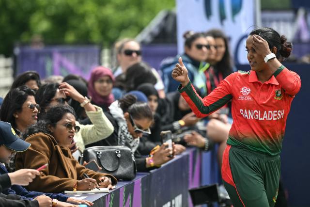 Bangladesh's Nigar Sultana (R) gives a thumbs up for fans during an exhibition at The Captains' Carnival, the activation event for the ICC Women's T20 cricket world cup 2026, in central London on June 7, 2026. (Photo by JUSTIN TALLIS / AFP)