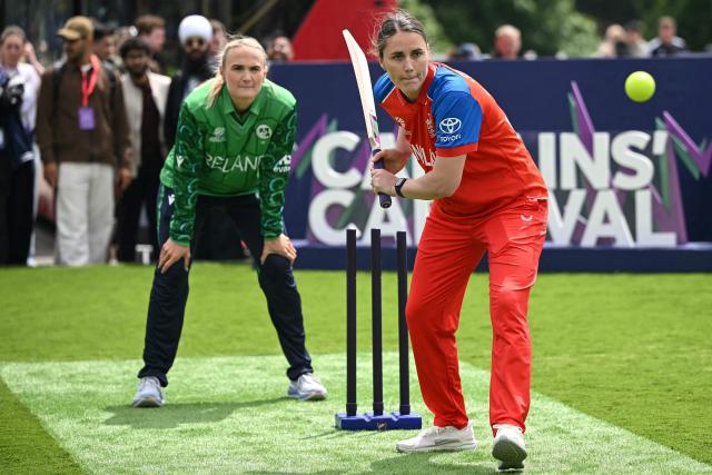Ireland’s Gaby Lewis (L) looks on as England’s Nat Sciver-Brunt (R) plays a shot during an exhibition at The Captains' Carnival, the activation event for the ICC Women's T20 cricket world cup 2026, in central London on June 7, 2026. (Photo by JUSTIN TALLIS / AFP)