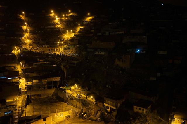 An aerial view of the San Juan de Lurigancho neighbourhood, on the northern outskirts of Lima, where Peru's presidential candidate Keiko Fujimori, for the Fuerza Popular party, will attend an election-day breakfast on June 7, 2026. (Photo by Ernesto BENAVIDES / AFP)