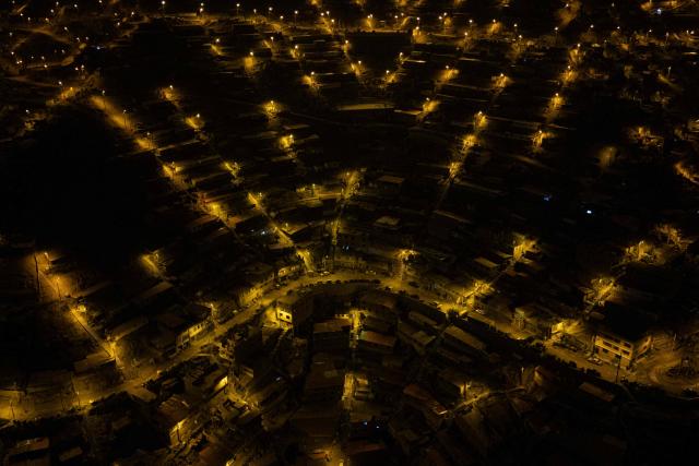 An aerial view of the San Juan de Lurigancho neighbourhood, on the northern outskirts of Lima, where Peru's presidential candidate Keiko Fujimori, for the Fuerza Popular party, will attend an election-day breakfast on June 7, 2026. (Photo by Ernesto BENAVIDES / AFP)