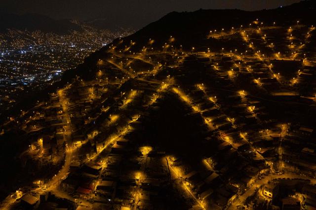 An aerial view of the San Juan de Lurigancho neighbourhood, on the northern outskirts of Lima, where Peru's presidential candidate Keiko Fujimori, for the Fuerza Popular party, will attend an election-day breakfast on June 7, 2026. (Photo by Ernesto BENAVIDES / AFP)