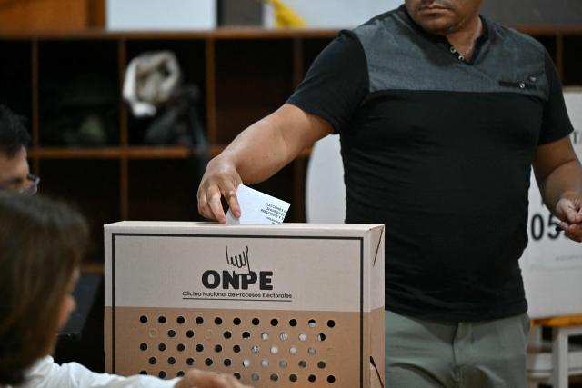 A man casts his vote during the presidential election runoff in Lima on June 7, 2026. Peruvians will choose their ninth president in 10 years, in a tight runoff election between conservative Keiko Fujimori and leftist Roberto Sanchez who are trying to woo voters fed up with political chaos and rising crime. (Photo by MARTIN BERNETTI / AFP)