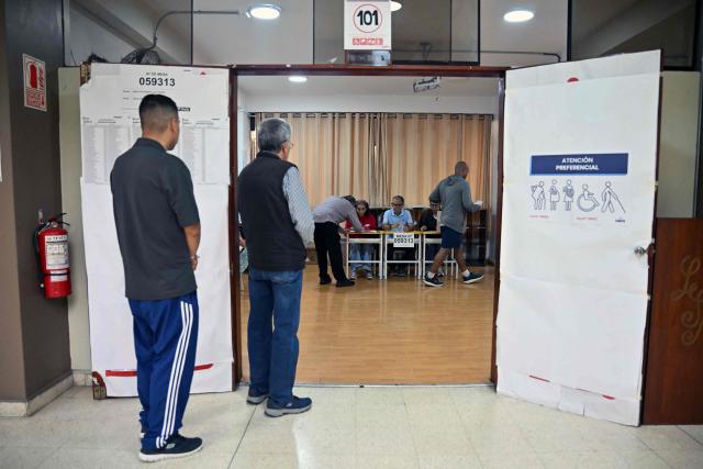 People wait to vote during the presidential election runoff in Lima on June 7, 2026. Peruvians will choose their ninth president in 10 years, in a tight runoff election between conservative Keiko Fujimori and leftist Roberto Sanchez who are trying to woo voters fed up with political chaos and rising crime. (Photo by MARTIN BERNETTI / AFP)