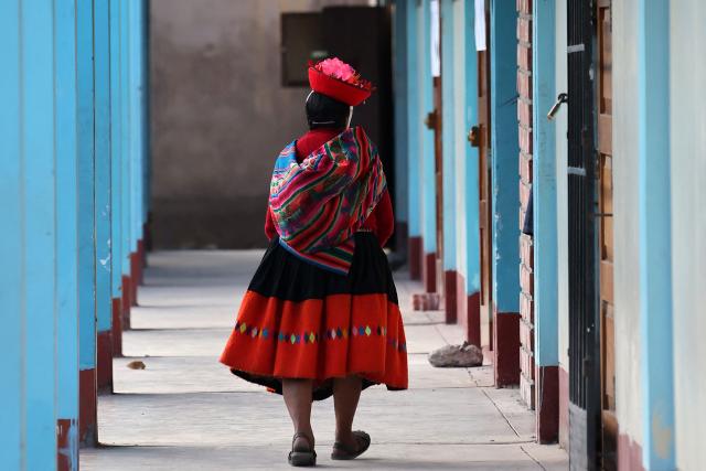 A local resident walks at a polling station during the presidential election runoff in Ollantaytambo, department of Cusco, Peru, on June 7, 2026. Peruvians will choose their ninth president in 10 years in a tight runoff election between conservative Keiko Fujimori and leftist Roberto Sanchez, who are trying to woo voters fed up with political chaos and rising crime. (Photo by Jose Angulo / AFP)